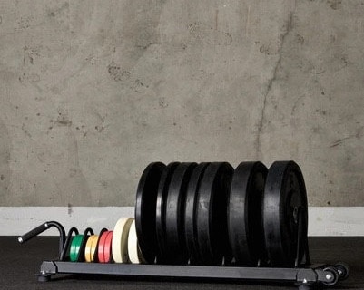 American Barbell Horizontal Rolling Bumper Storage full view with plates