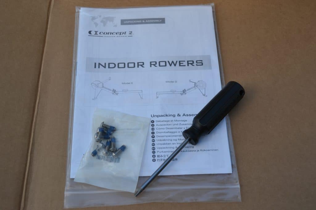 A small number of screws, screwdriver, and assembly instructions - all that you need to assemble a Concept 2 Model D indoor rower for your home or garage gym.