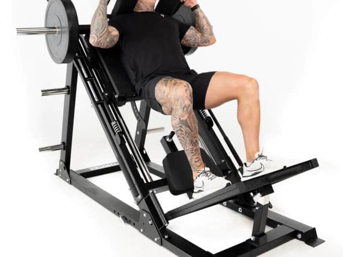 Force USA Ultimate 45 Degree Leg Press Hack Squat Combo with an athlete