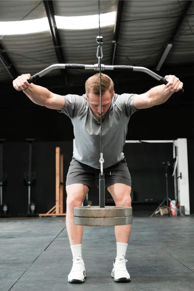 Fringe Sport Lat & Lift Cable Pulley System with an athlete 8