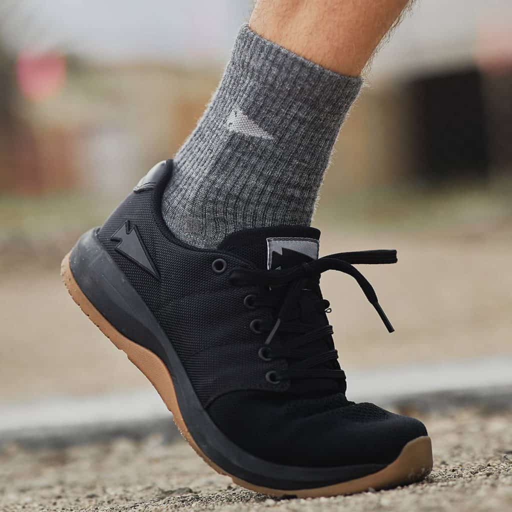 GORUCK Merino Challenge Socks charcoal worn by an athlete