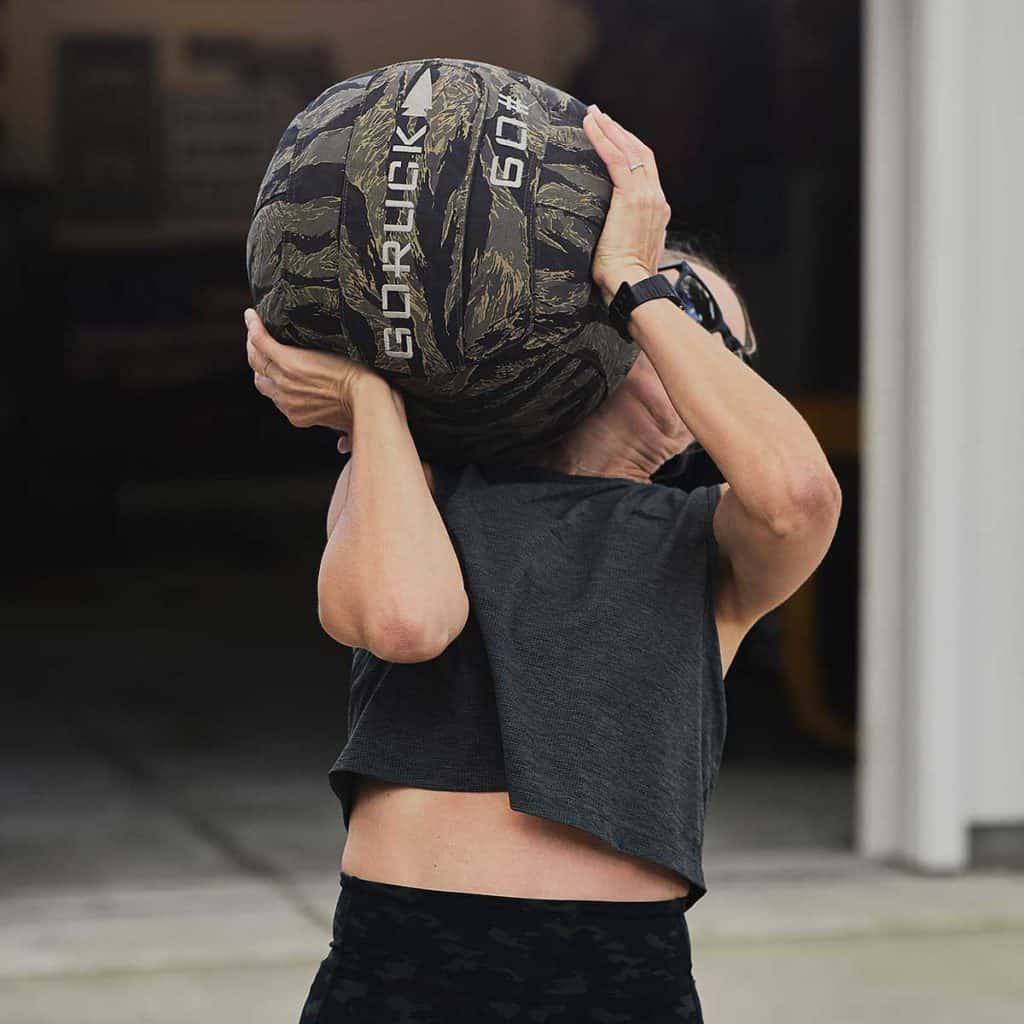 GORUCK Sand Medicine Ball 60lb with an athlete 2