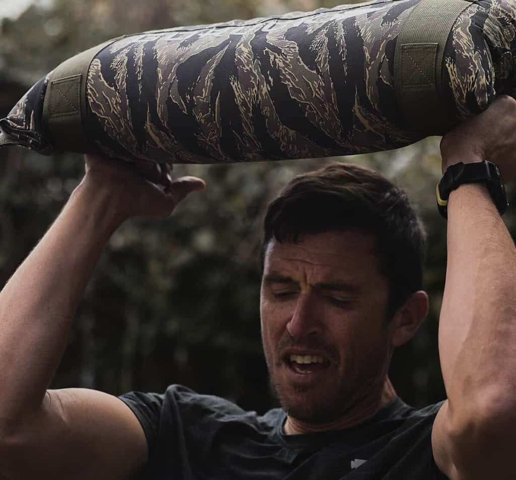 GORUCK Simple Training Sandbag 60lb with an athlete 3