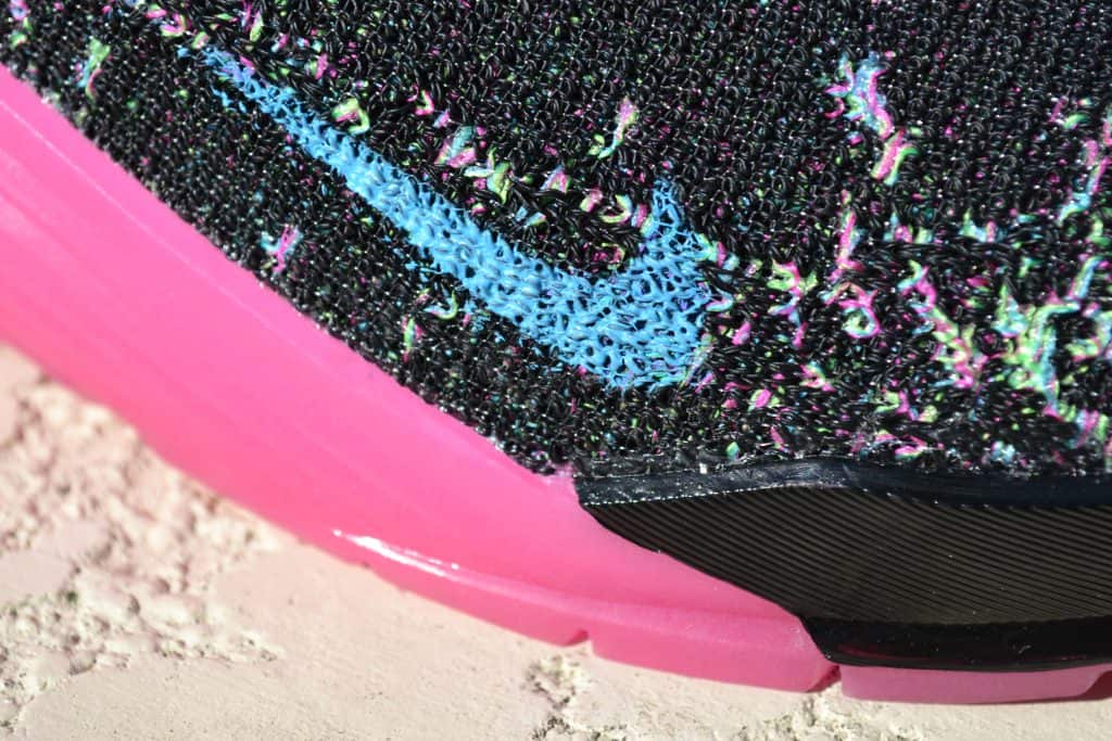 Flyknit closeup of the Nike React Metcon AMP Training Shoe - Black/Fire Pink/Green Strike/Blue Fury (with Glow-In-The-Dark Sole)