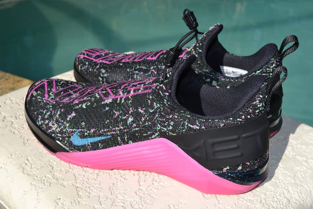 Heel view of the Nike React Metcon AMP Training Shoe - Black/Fire Pink/Green Strike/Blue Fury (with Glow-In-The-Dark Sole)