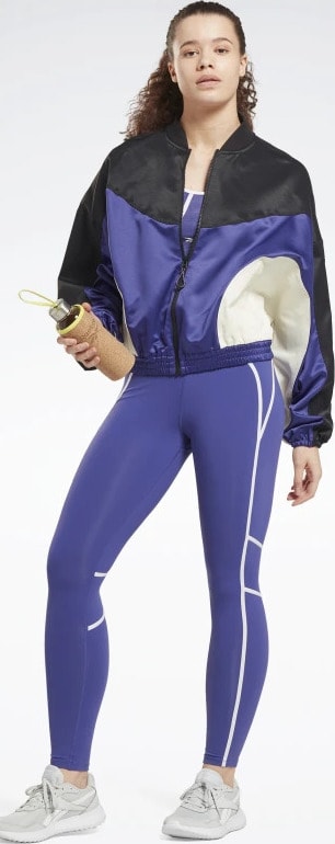 Reebok Lux High-Waisted Colorblock Tights worn with a jacket