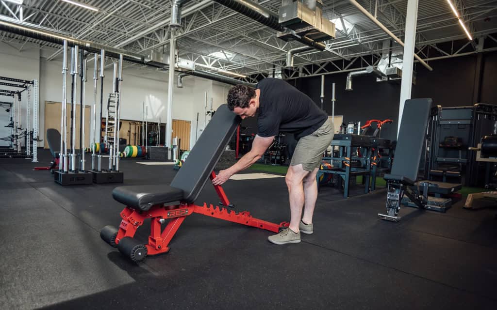 Rep Fitness AB-3000 2.0 FID Adjustable Weight Bench with an athlete 2