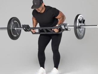 Rep Fitness Cambered Swiss Bar with a user 4