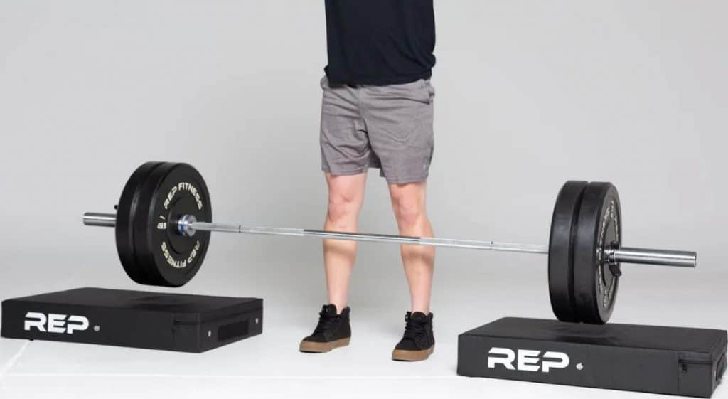 Rep Fitness Drop Pad under a barbell pair