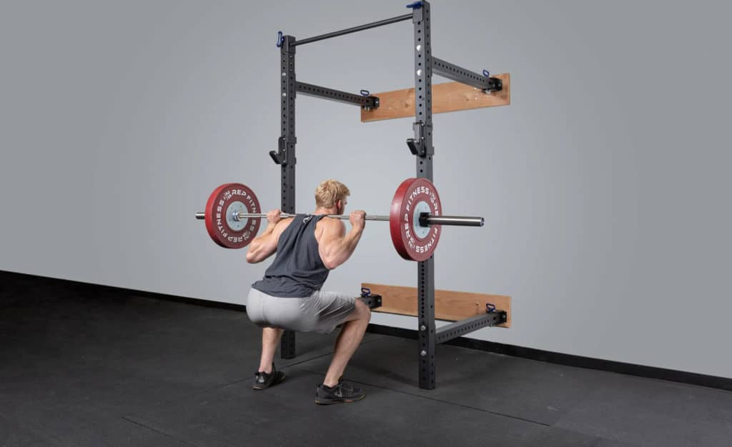 Rep Fitness PR-4100 Folding Squat Rack with an athlete 3