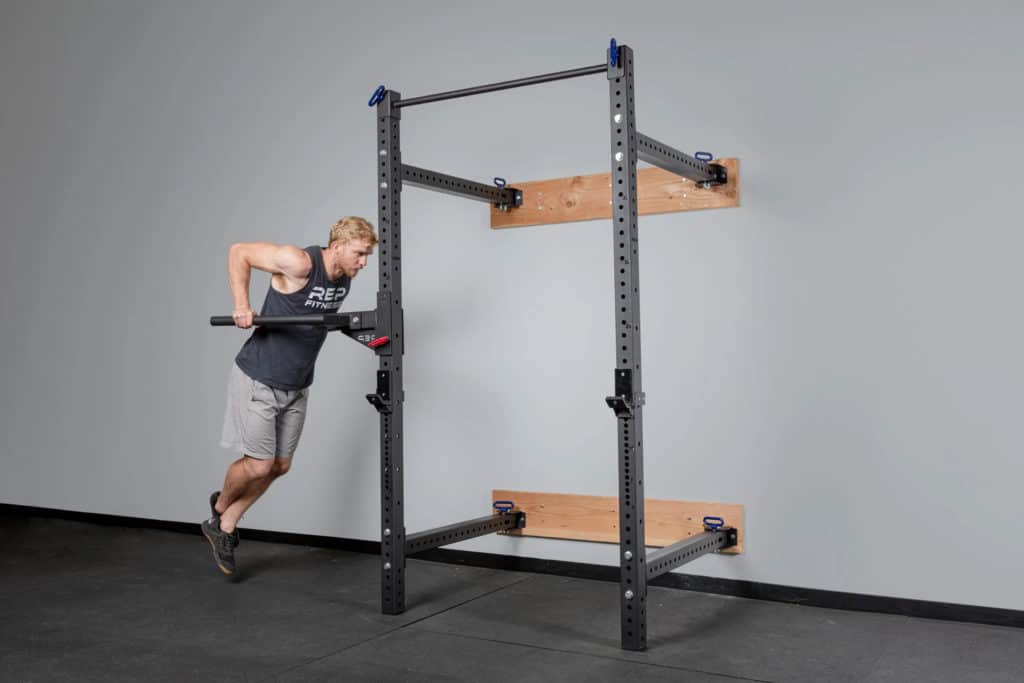 Rep Fitness PR-4100 Folding Squat Rack with an athlete 5