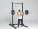 Rep Fitness SR-4000 Squat Rack back view carrying barbell
