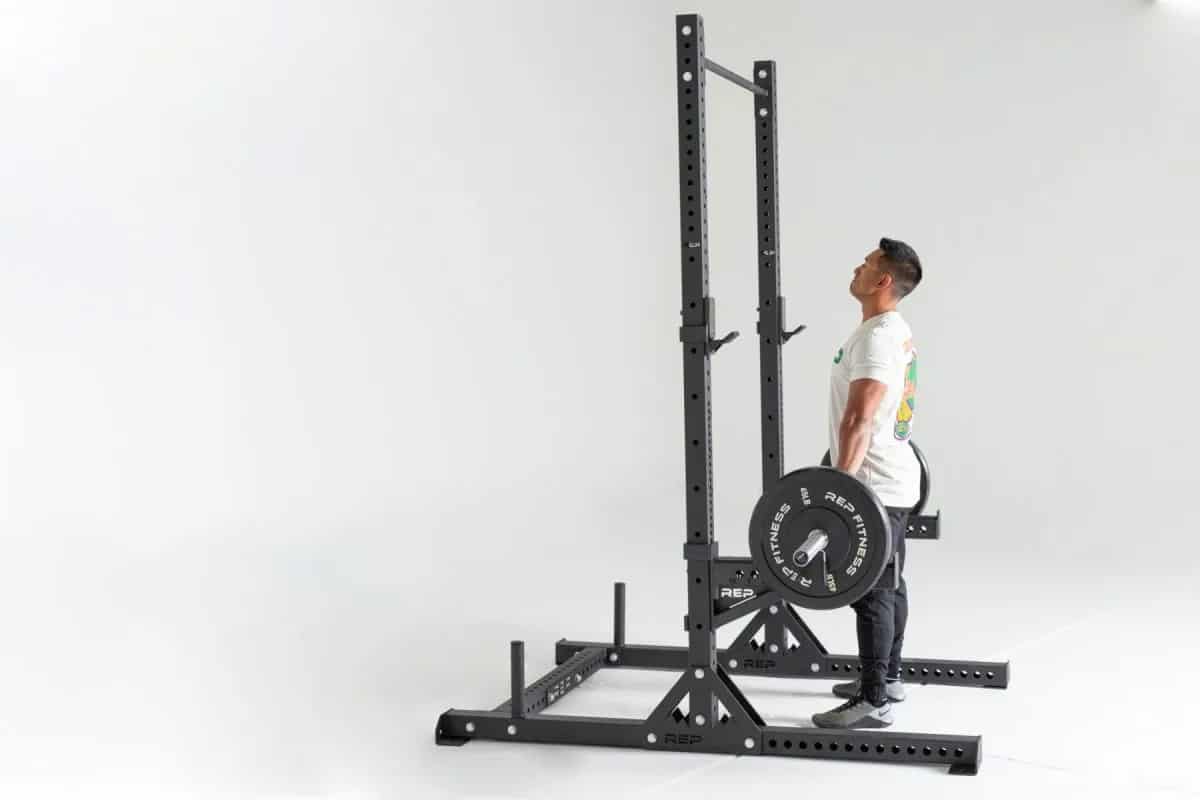 Rep Fitness SR-4000 Squat Rack side view carrying barbell