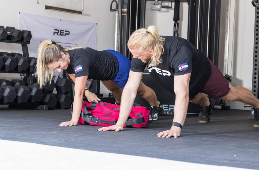 Rep Fitness Sandbags with athletes 3