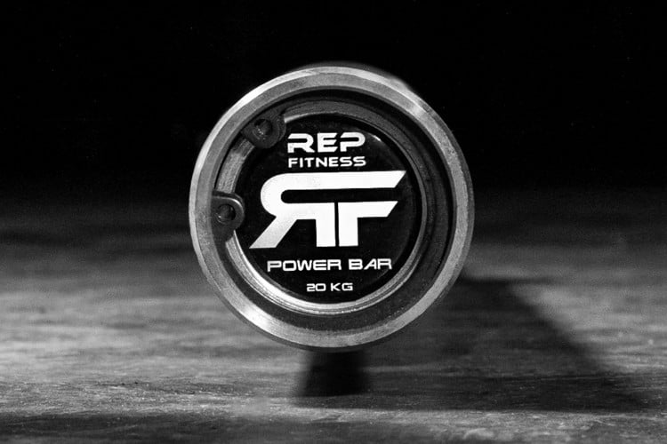 Snap ring endcap and logo on the Rep Fitness Power Bar v2 - made with Stainless Steel