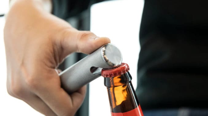 Rogue 25MM Knurled Bottle Opener opening a bottle