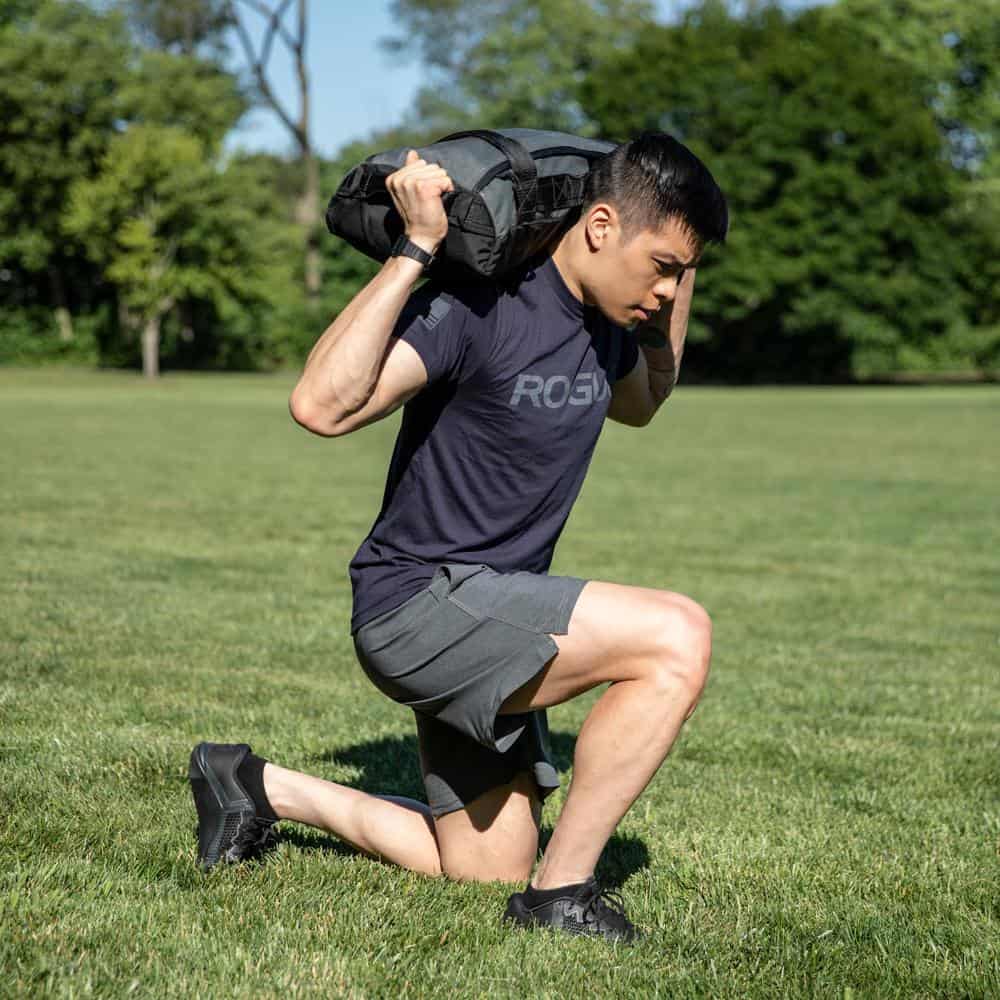 https://fitatmidlife.com/wp-content/uploads/Rogue-3-in-1-Sandbag-lunge.jpg