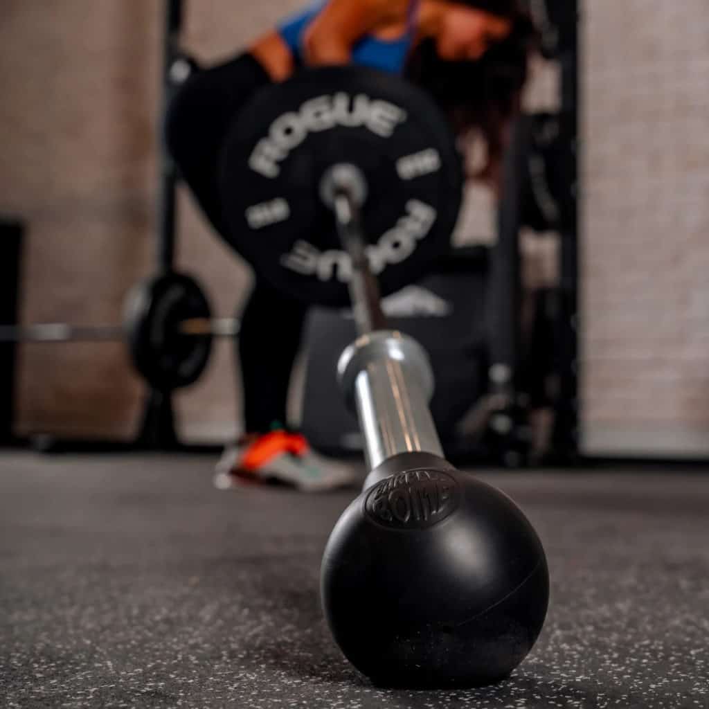 Rogue Fitness AbMat Barbell Bomb with an athlete