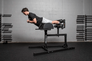 A Rogue Abram Glute Ham Device in use by an athlete.