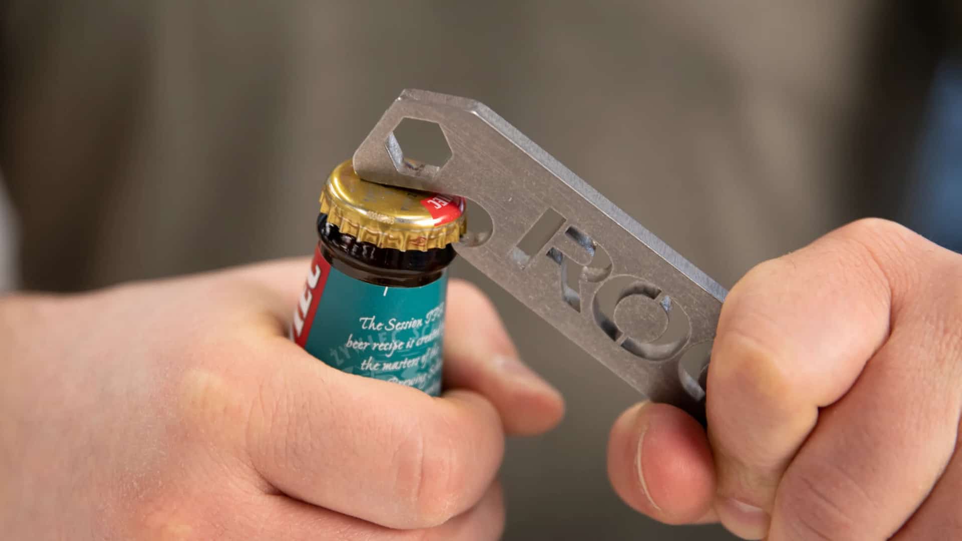Rogue Wrenches opening a bottle