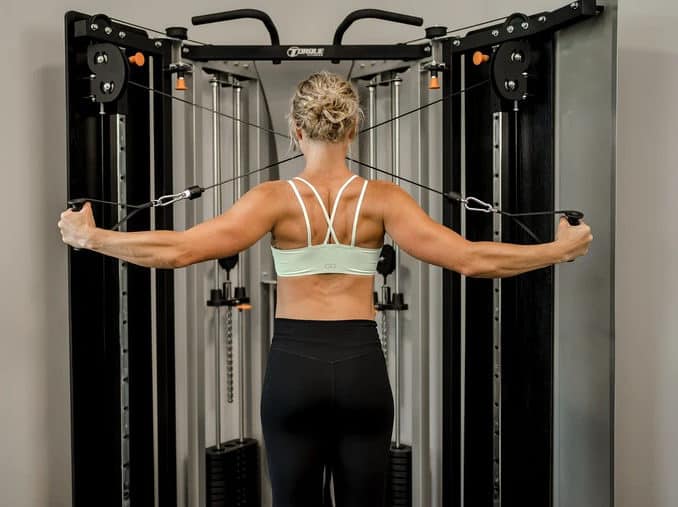Torque Fitness F9 Fold-Away Functional Trainer with a user