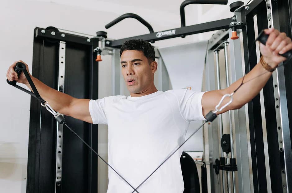 Torque Fitness F9 Functional Trainer (up to $400 Off) with an athlete