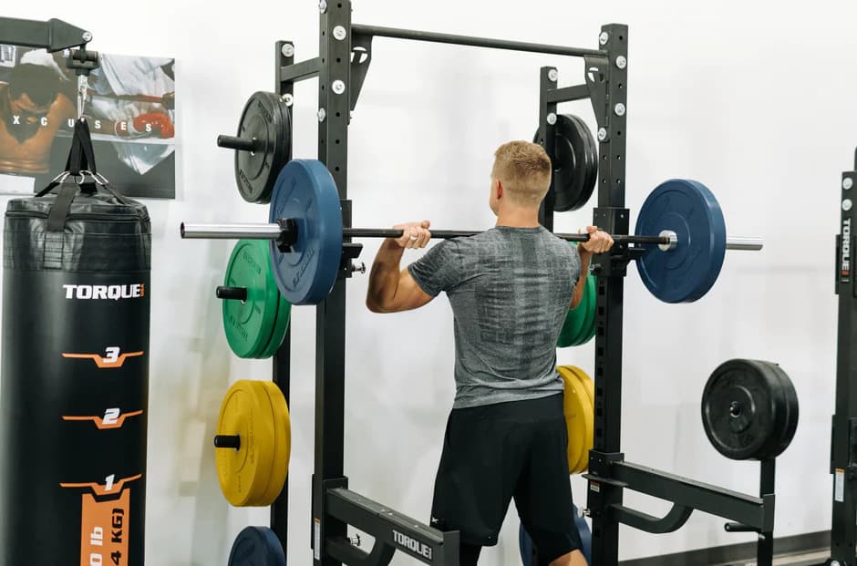 Torque Fitness Lifting Racks (20% Off) with an athlete 7
