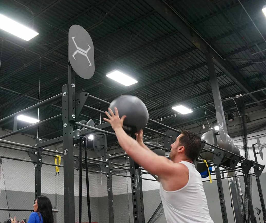 Torque Fitness Wall Ball Target with a user