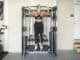 Torque USA F9 Wall-Mounted Functional Trainer with an athlete