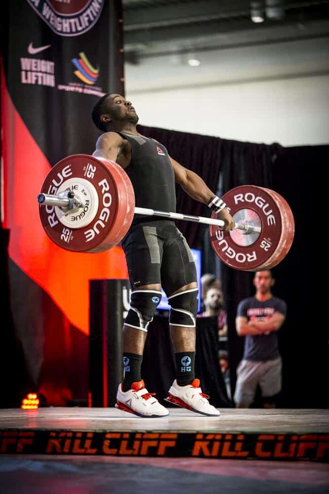 Olympic weight lifter on the competition platform - wearing lifting shoes