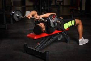 Tricep extension on a flat weight bench - a great exercise for triceps and strength
