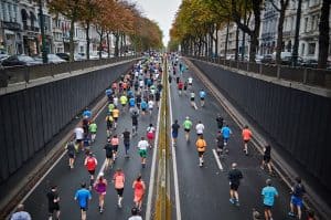 Does the prolonged intensity of a marathon expose you to opportunistic infection, or is it the large crowd and their associated pathogens?