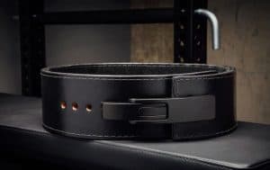 Made in the USA from 100% genuine sole leather, the Rogue Black 13mm Lever Belt is a variation on their original 13mm Powerlifting Belt, utilizing a new, patented lock-in lever design (made from nickel-plated steel) in place of a traditional buckle. This durable belt is uniquely murdered out with a matte-black lever, black hardware, a black suede liner, and an embossed Rogue logo. The edges are beveled for added comfort, and the liner helps prevent any movement or slippage as you train.