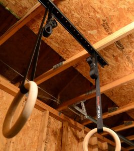 The weight bearing hanger is the professional solution for hanging your gymnastics rings, maximizing space and versatility in your garage or warehouse.