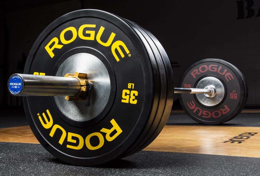 A Rogue Olympic weightlifting barbell - loaded with Rogue training bumper plates
