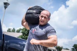 Sandbags can be shouldered - this is an intense workout.  The Rogue sandbag is unique in that it can be loaded very heavy.