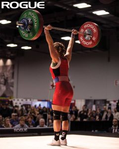 USA Weightlifting- a competitor on the platform sporting weightlifting shoes with a raised heel